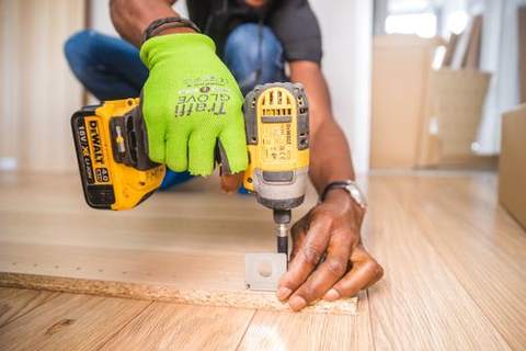Hands using a drill