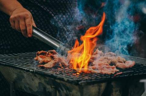 Meat grilling over open flames